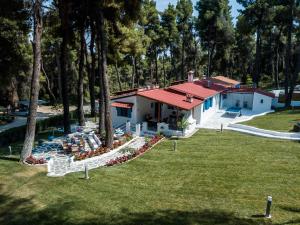 an aerial view of a house with a yard at Forest Sani Villa in Sani Beach