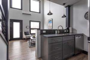 a kitchen with a sink and a counter top at Center City Lofts 508 Unit 2 Close to Downtown and the TART Trail in Traverse City