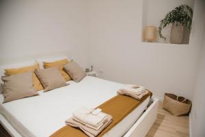 Ένα ή περισσότερα κρεβάτια σε δωμάτιο στο Le Sorelle - casa vacanze