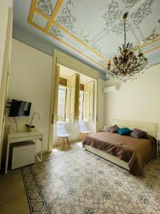 En eller flere senge i et værelse på Be Happy Salerno