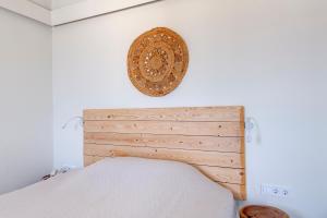 A bed or beds in a room at Faros Resort