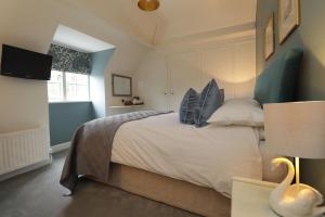 Ein Bett oder Betten in einem Zimmer der Unterkunft Leeds Castle Stable Courtyard Bed and Breakfast