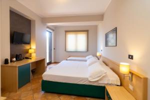 Cama o camas de una habitación en Hotel Federica
