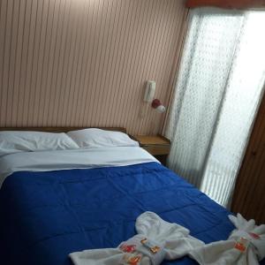 Una cama o camas en una habitación de Hotel Drumond
