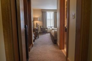 Ένα ή περισσότερα κρεβάτια σε δωμάτιο στο The Carraig Hotel