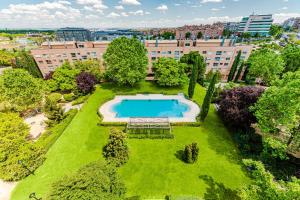 an overhead view of a park with a swimming pool at Las Huertas - Modern Accommodation in Madrid Conde Orgaz in Madrid