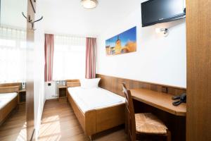 TV a/nebo společenská místnost v ubytování Hotel Alt Bamberg