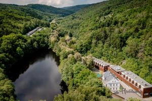 an aerial view of a building next to a river at Restaurace a Pension Hřebíkárna in Chomutov