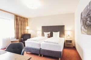 Postel nebo postele na pokoji v ubytování Hotel Johanna mitten im Ötztal