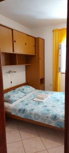 Ein Bett oder Betten in einem Zimmer der Unterkunft Danijel