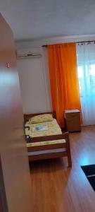 Ein Bett oder Betten in einem Zimmer der Unterkunft Danijel