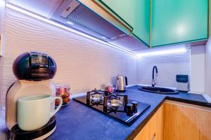 a coffee maker sitting on a counter in a kitchen at SUMMER QUANTUM VALENTINE'S APARTMENT in Năvodari +51 photos