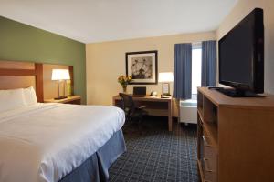 A television and/or entertainment centre at Canadas Best Value Inn Toronto