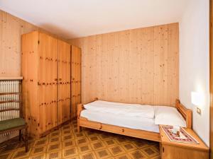 Postel nebo postele na pokoji v ubytování Ciasa Lino Sas da le Undesc