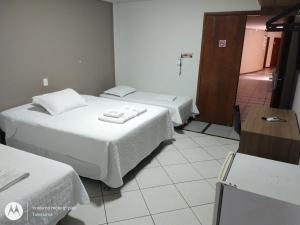 Giường trong phòng chung tại Hotel Ravenna