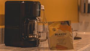 a coffee maker and a box on a counter at Los Ciruelos Oaxaca in Oaxaca City