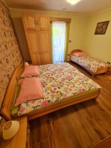 a bedroom with two beds in a room at Domačija Bubec in Ilirska Bistrica