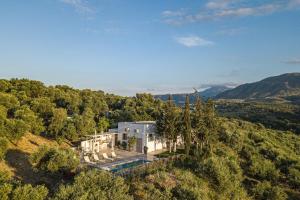 an aerial view of a house in the hills at MariAndry Villa, Enchanting Secluded Retreat, By ThinkVilla in Episkopi