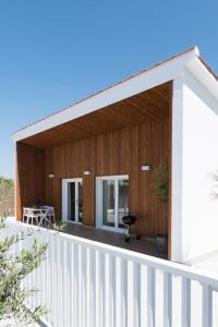 a balcony of a house with a white fence at 2Casas in Pontevedra