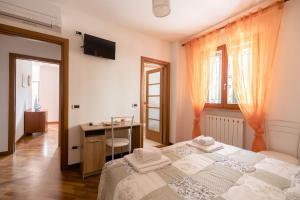 Postel nebo postele na pokoji v ubytování Les Chambres