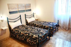 A bed or beds in a room at CASA PAOLINA NEL CENTRO DI BRACCIANO