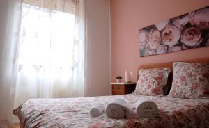 A bed or beds in a room at CASA PAOLINA NEL CENTRO DI BRACCIANO