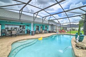 a large swimming pool with a glass roof at Florida Family Home with Private Pool and Dock! in Clermont