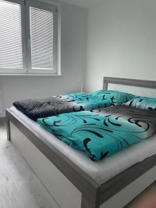 Posteľ alebo postele v izbe v ubytovaní FineByt