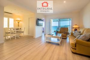 a living room with a couch and a table at Torre Marina Apartments in Calonge