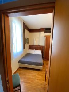Postel nebo postele na pokoji v ubytování Hotel Bellevue