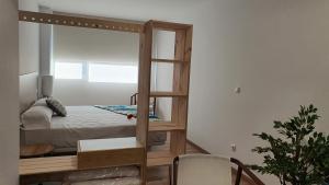 Łóżko lub łóżka w pokoju w obiekcie Apartamentos Antares 3