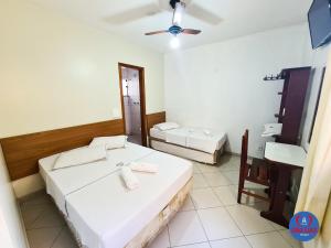 En eller flere senge i et værelse på Hotel São Luiz + 70 billeder