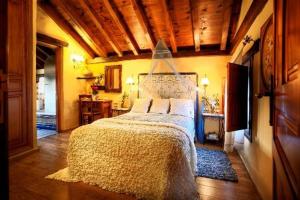 מיטה או מיטות בחדר ב-Posada Los Cantaros