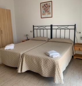Posteľ alebo postele v izbe v ubytovaní Aparthotel Iris