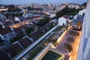 a view of a city from the roof of a building at Memmo Príncipe Real - Design Hotels in Lisbon