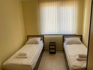 A bed or beds in a room at 3 Room Family Apartment with Pool View (4 min. away from the Sea)