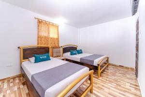Łóżko lub łóżka w pokoju w obiekcie Ayenda 1305 Retro