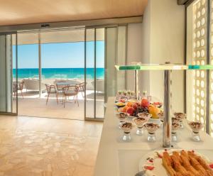 a buffet table with food and a view of the ocean at RH Bayren Hotel & Spa 4* Sup in Gandía