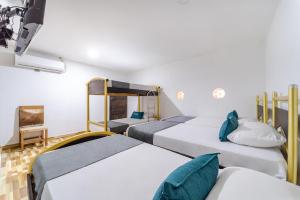 Łóżko lub łóżka w pokoju w obiekcie Ayenda 1305 Retro