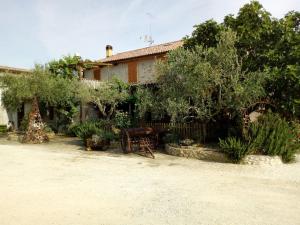 a house with trees and plants in front of it at B&B Cagnona in Borghi