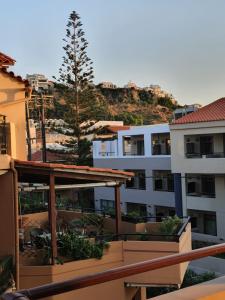 a view from the balcony of a apartment building at Vasiliki Apartments in Plataniás