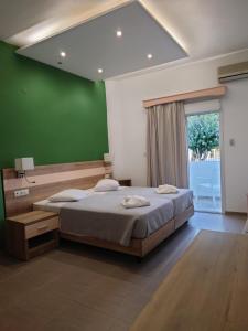 Postel nebo postele na pokoji v ubytování Ifigenia Hotel + 37 fotografií