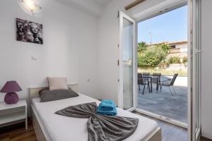 Postel nebo postele na pokoji v ubytování Apartment Monika with private pool in Porec