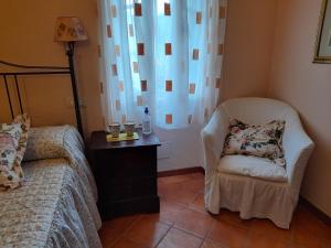 Rúm í herbergi á Gli Ulivi Bed & breakfast