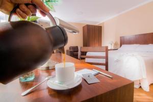 Postel nebo postele na pokoji v ubytování Fenix Hotel + 37 fotografií