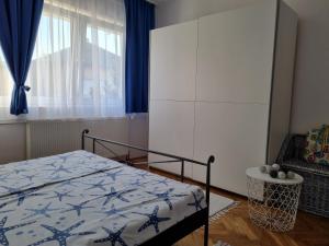 Posteľ alebo postele v izbe v ubytovaní Apartman Nataly