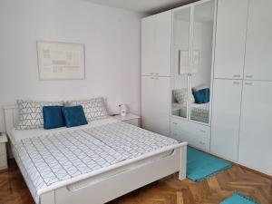 Postel nebo postele na pokoji v ubytování Apartman Nataly