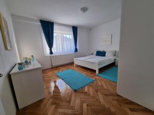 Posteľ alebo postele v izbe v ubytovaní Apartman Nataly