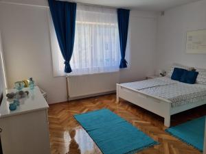 Posteľ alebo postele v izbe v ubytovaní Apartman Nataly
