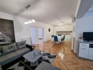 a living room with a couch and a table at Apartman Nataly in Varaždin